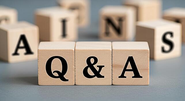 Wooden blocks displaying Q A on a gray surface representing questions and answers in a learning environment symbolizing knowledge information exchange and problemsolving with a clean and minimalist ae photo
