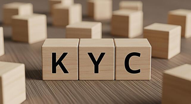 Wooden blocks displaying KYC on a wooden surface representing the concept of Know Your Customer compliance and due diligence in a financial and regulatory environment conveying trust and security photo