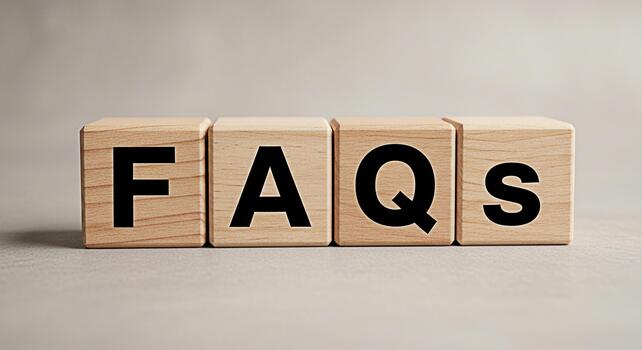 Wooden blocks displaying FAQs on a neutral surface representing information and customer support creating a clear and accessible resource for answering common questions and providing assistance photo