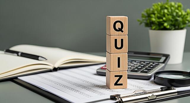 Wooden blocks spelling QUIZ on a desk with a calculator notebook and magnifying glass representing knowledge assessment and the challenge of answering questions in an educational environment photo