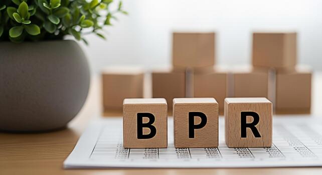 Wooden blocks spelling BPR resting on a financial report in a bright office symbolizing Business Process Reengineering and efficiency promoting a concept of streamlined operations and improved perform photo