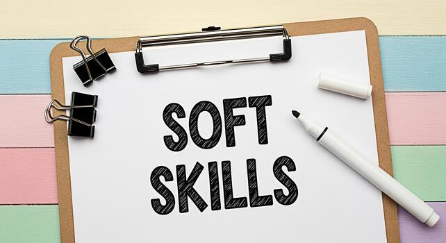 Closeup of a clipboard displaying Soft Skills written on a white sheet of paper placed on a colorful wooden surface emphasizing the importance of interpersonal and emotional intelligence in profession photo