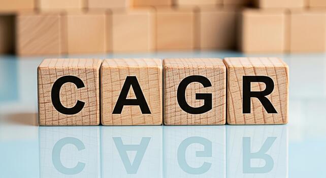 Wooden blocks displaying CAGR on a reflective surface symbolizing growth and financial success in a business environment conveying a message of compound annual growth rate and investment strategy photo