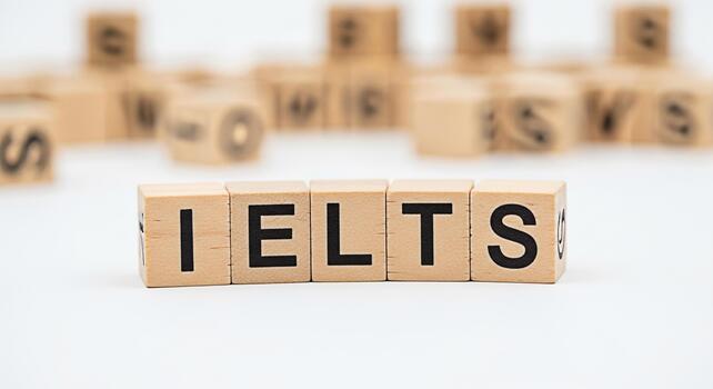 Wooden blocks spelling IELTS on a white surface representing the International English Language Testing System conveying a message of preparation and success in language proficiency assessment photo