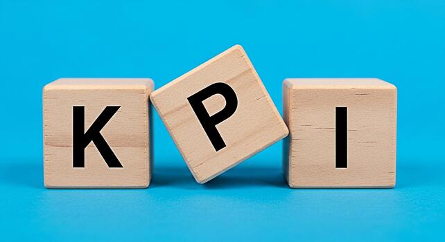 Wooden blocks displaying KPI on a blue background representing key performance indicators for business success and strategic planning in a corporate environment conveying a sense of achievement photo