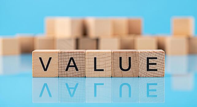 Wooden blocks spelling VALUE on a reflective blue surface symbolizing importance and worth in a business environment conveying a message of core principles and ethical standards photo