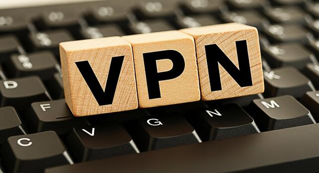 Wooden blocks spelling VPN resting on a computer keyboard symbolizing secure online browsing and data encryption for privacy and anonymity in the digital world conveying trust and safety photo