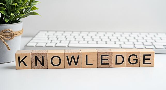 de madera bloques ortografía conocimiento arreglado en un blanco escritorio con un teclado y en conserva planta representando aprendizaje educación y el búsqueda de sabiduría en un moderno espacio de trabajo Fomentando un positivo y Inspirar foto