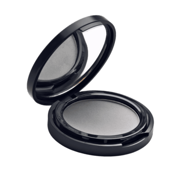 grigio ombretto nel un' compatto Astuccio è Aperto su un' piatto superficie, in mostra suo liscio superficie e specchio dentro. png