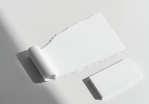 Elegant white paper composition with a textured torn edge and blank card stack for a clean design template mock-up photo