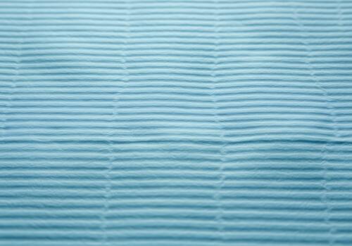 A soothing light blue textured background with subtle horizontal linear patterns creating a serene and versatile design element photo