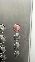 Elevator buttons for floor selection, silver buttons of a large elevator 13th floor. High quality video
