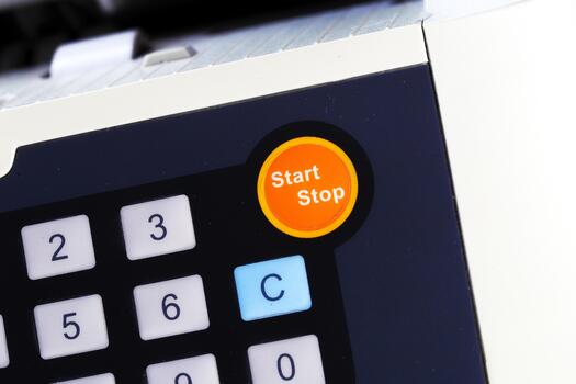 Control panel features start stop button for device operation in modern office setting photo