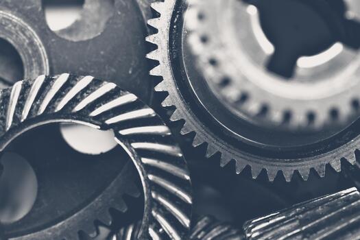 Close-up view of metallic gears and cogs arranged in an artistic composition photo