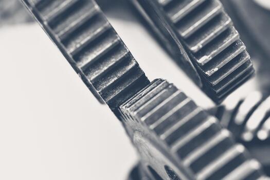 Close-up view of interlocking gears in a mechanical device showing intricate details photo