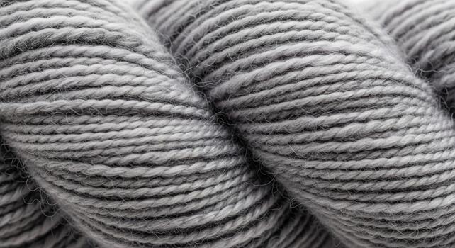 Close up macro view of tightly wound grey and white striped yarn creating a textured abstract pattern for crafts photo