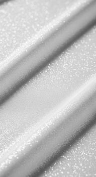 Close up abstract view of textured white corrugated material with diagonal lines and subtle shadows creating depth and pattern photo