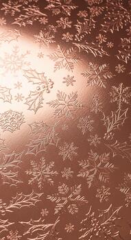 Intricate floral pattern embossed on a shimmering rose gold metallic surface creating a luxurious and elegant background texture photo