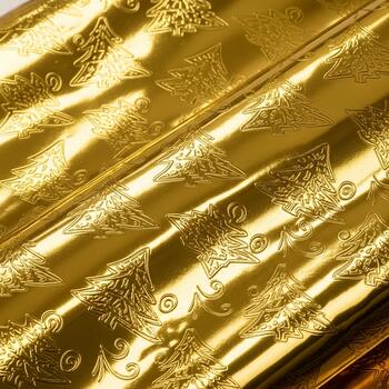 Luxurious golden fabric with intricate floral patterns reflecting light and creating a rich opulent texture photo