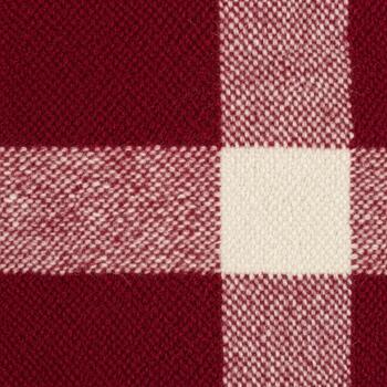 Close up view of a rustic buffalo plaid fabric pattern in deep red and cream colors photo