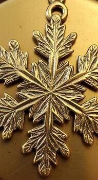 Intricate metallic snowflake ornament with detailed frosty leaf like branches and a central loop for hanging photo