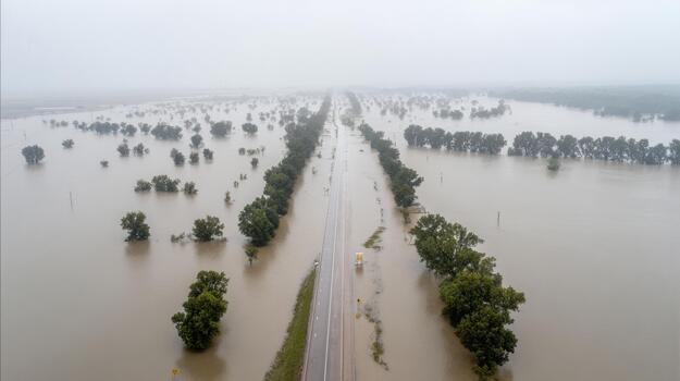 Flooded Highway And Surrounding Landscape Aerial View. Severe Flooding Impacts Transportation And Environment photo