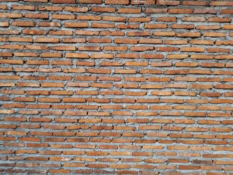 Rustic red clay brick stack texture background photo