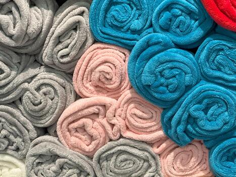 Rolled Towels in Multicolor Rows,Shelf Display with Soft Texture Harmony photo