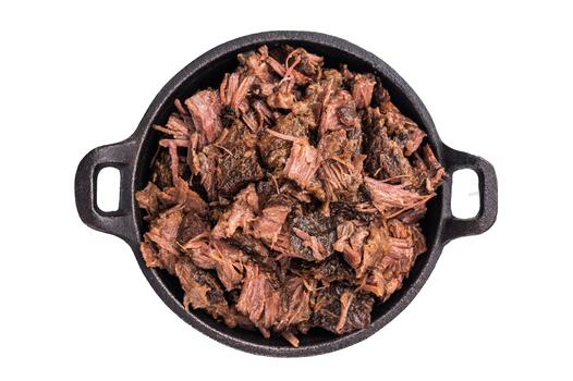 Barbecue wagyu meat torn to bits pulled beef in a skillet isolated on white background. top view photo