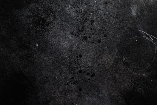 Black cement texture with subtle gray gradients ideal for rustic culinary scenes and stylish tabletop compositions. photo