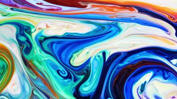 Liquid Color Fusion on Reflective Surface Forms Vibrant Patterns video