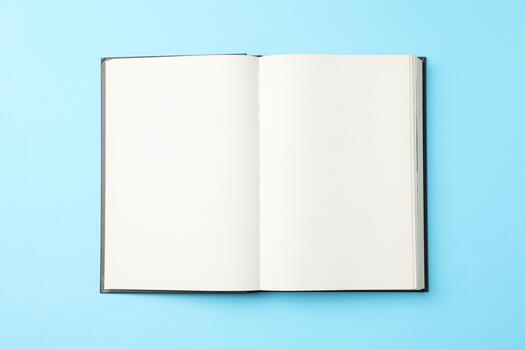 Opened empty book on blue background, top view Opened empty book on blue background, top view photo