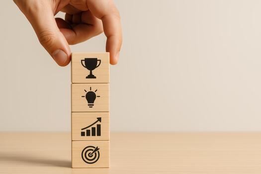 2026 roadmap planning concept with wooden blocks showing success, idea, growth, and target symbols stacked on table with hand placing top block for motivation and achievement photo