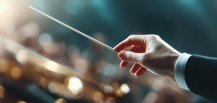 Conductor hand gracefully guides orchestra during rehearsal, showcasing art of music direction. blurred motion captures energy and passion of performance photo