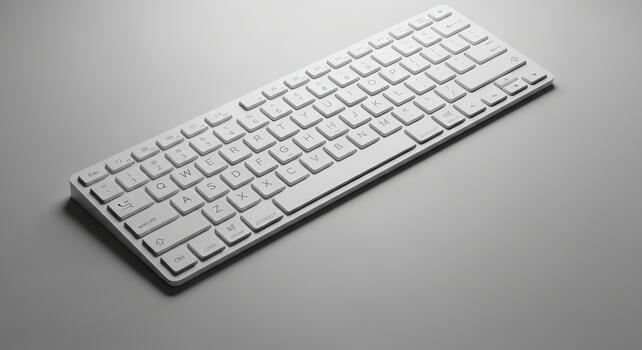Flat White Keyboard on a Gray Surface with Subtle Lighting and Shadows photo
