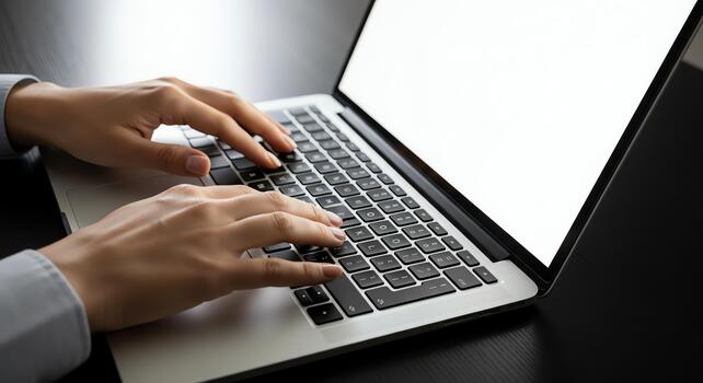 Typing on a Laptop Keyboard A Close-Up View of Hands Working on a Computer photo