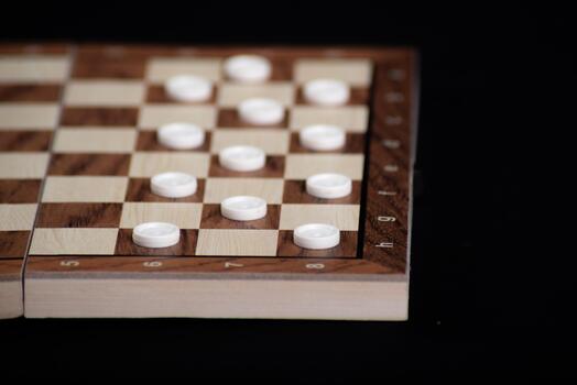 Checkerboard with light and dark pieces. Game concept. Board game. Hobby. Checkers on the playing field for a game photo