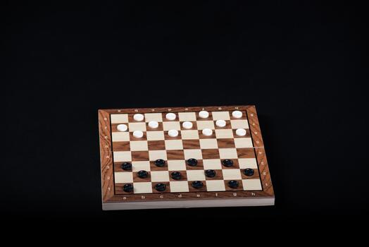 Checkerboard with checkers. Game concept. Board game. Hobby. Checkers on the playing field for a game. photo