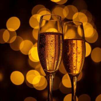 New Years Eve party atmosphere with champagne and a dense array of sparkling warm string lights photo