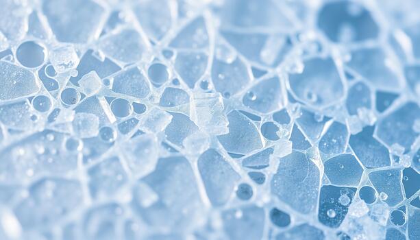 Blue toned background texture showing a complex system of intersecting cracks and frozen air photo