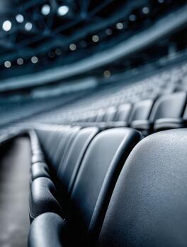 Empty stadium seats waiting for fans before a big game at night photo