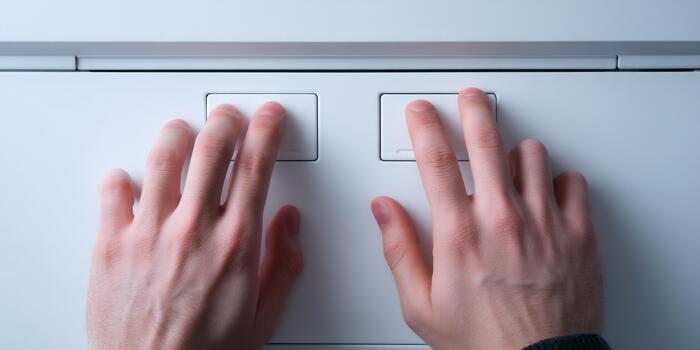 Hands pushing dual flush buttons saving water photo