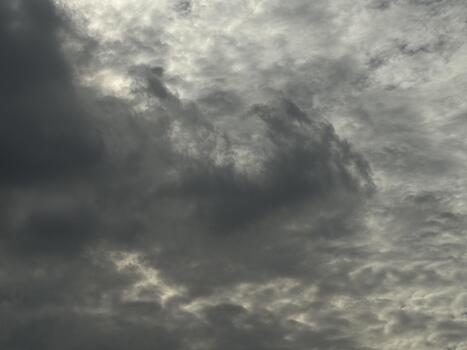 The sky is painted with strokes of grey, ominous clouds heavy with the promise of rainfall photo