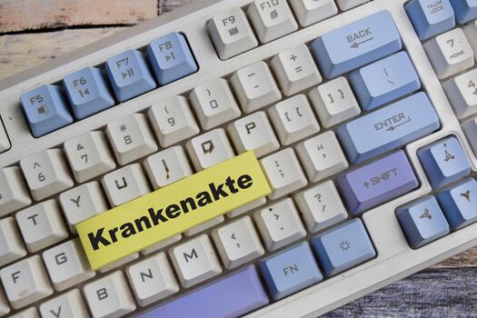 Concept of krankenakte in German it means medical record write on sticky notes isolated on Wooden Table. photo