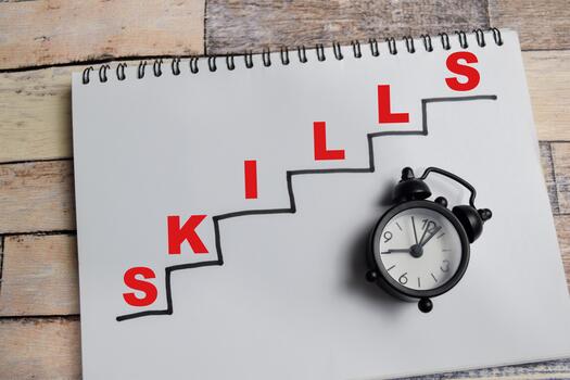 Concept of Skills update write on book with keywords isolated on Wooden Table. photo