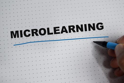 Concept of microlearning write on book isolated on Wooden Table. photo