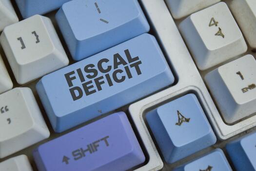 Fiscal deficit is a shortfall in a government income button on the keyboard photo