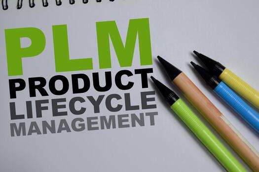 Concept of PLM - Product Lifecycle Management write on book isolated on Wooden Table. Innovation, production and maintenance management photo
