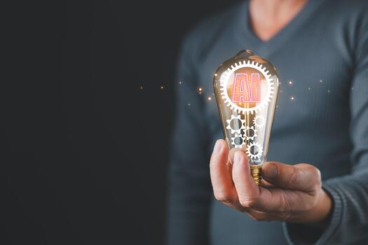 AI creative concept. A person holds a glowing lightbulb containing the letters AI and gears, the integration of artificial intelligence, innovation, and smart technology within creative solutions. photo