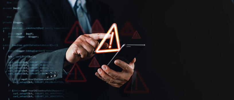 businessman in a suit uses a smartphone with floating warning icons and digital code overlay, symbolizing cybersecurity threats, system vulnerabilities, caution alerts, and digital risk awareness. photo